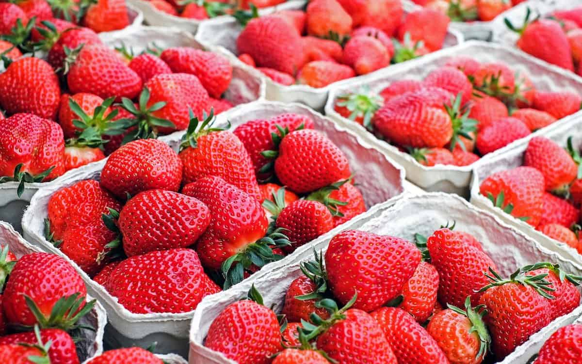 Strawberries in containers at stores. Strawberries in containers at stores.