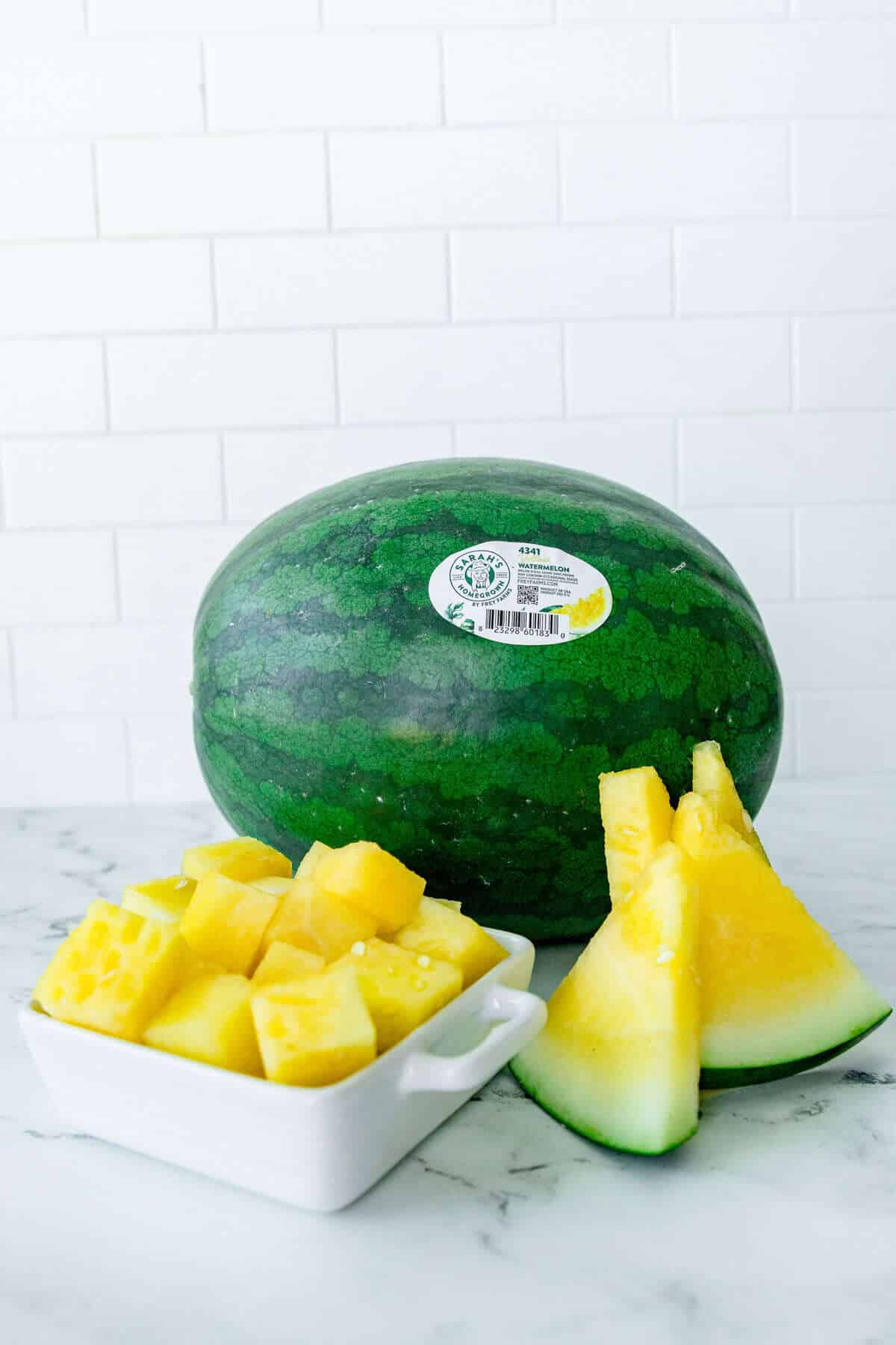Yellow watermelon sliced and cubed for a fresh, hydrating summer snack. Whole yellow watermelon, sliced watermelon wedges, and cubed watermelon pieces showcasing the fruit’s golden interior and use as a sustainable summer snack.