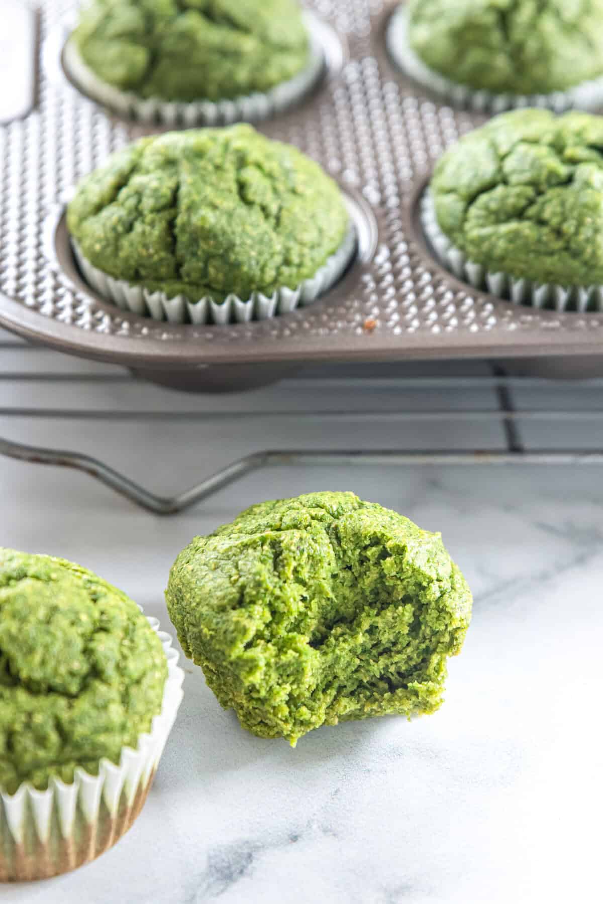 easy sweet spinach muffins Sweet spinach muffins c next to a baking sheet tray